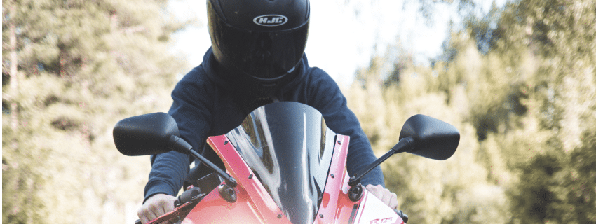 Motorcyclist practicing safe helmet laws