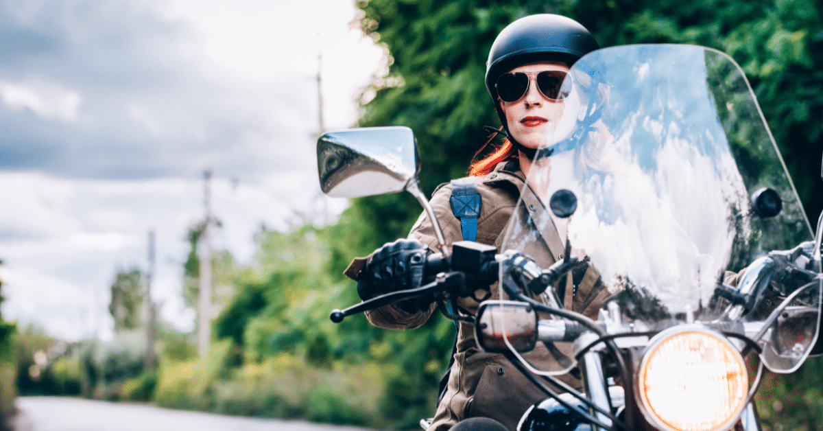 Female motorcyclist driving