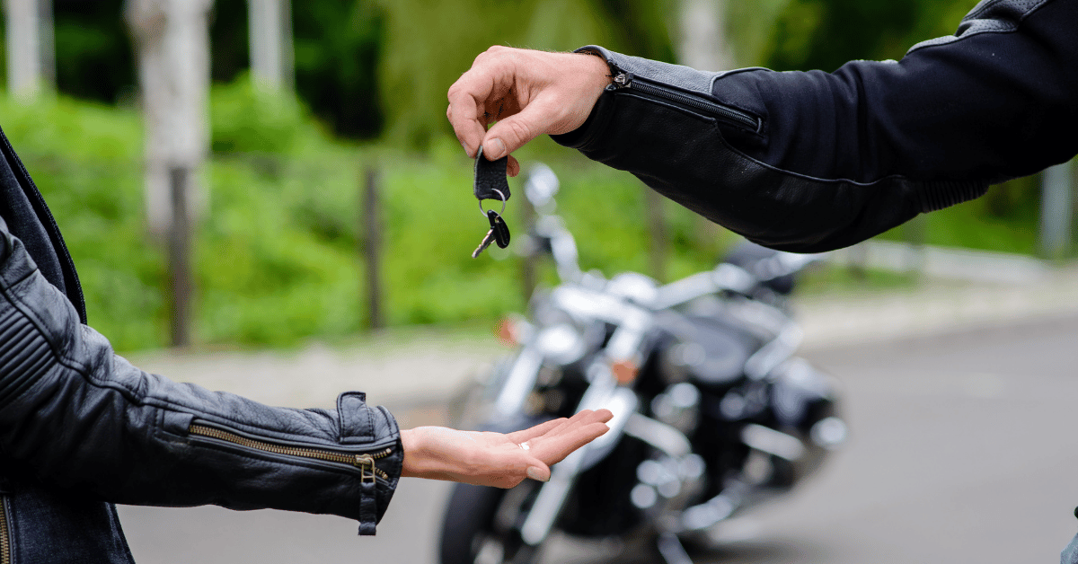 Handing over motorcycle keys, Dallas auction