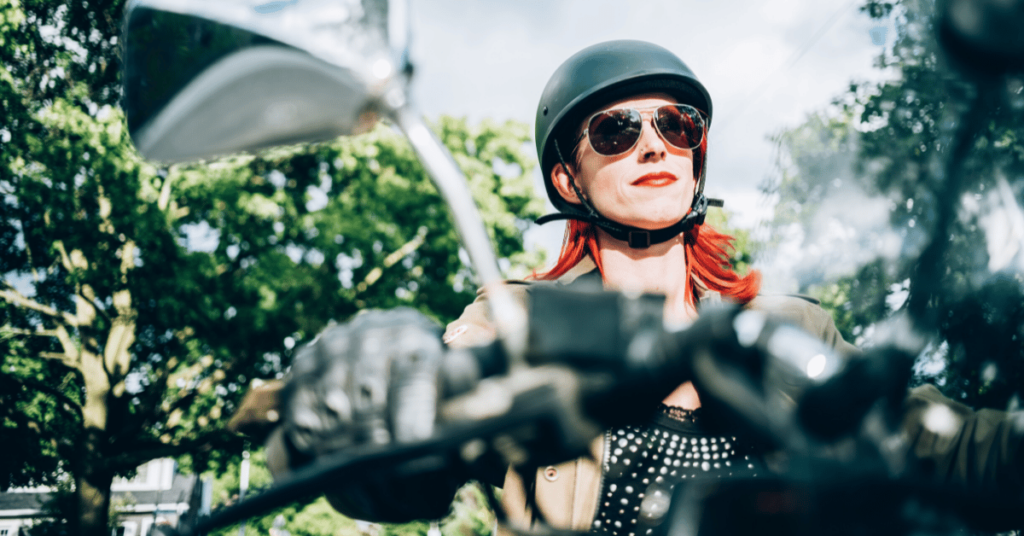 Female motorcyclist taking a relaxing daytime ride